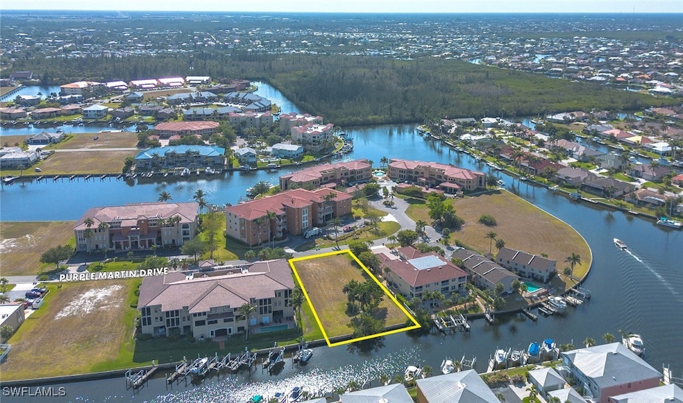 Aerial view of residential area with a nearby body
