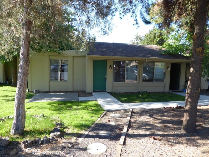 Front of condo, patio and lawn
