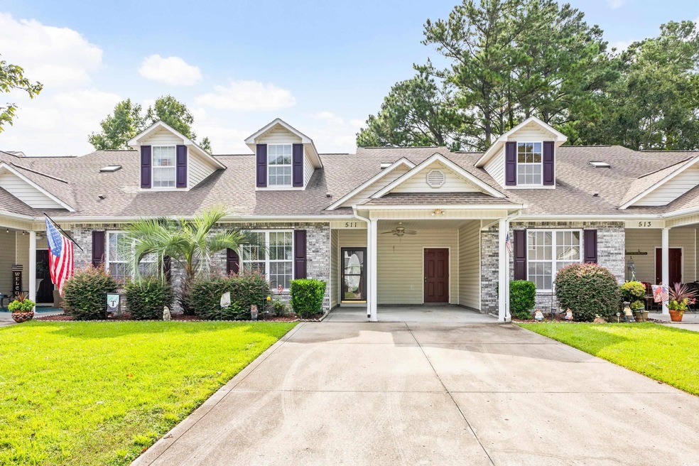 Cape cod-style house with a carport and a front ya