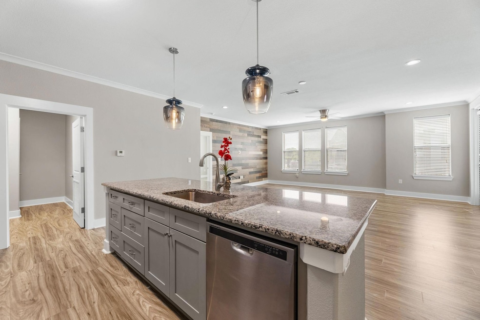 Kitchen featuring dishwasher, a sink, ornamental m