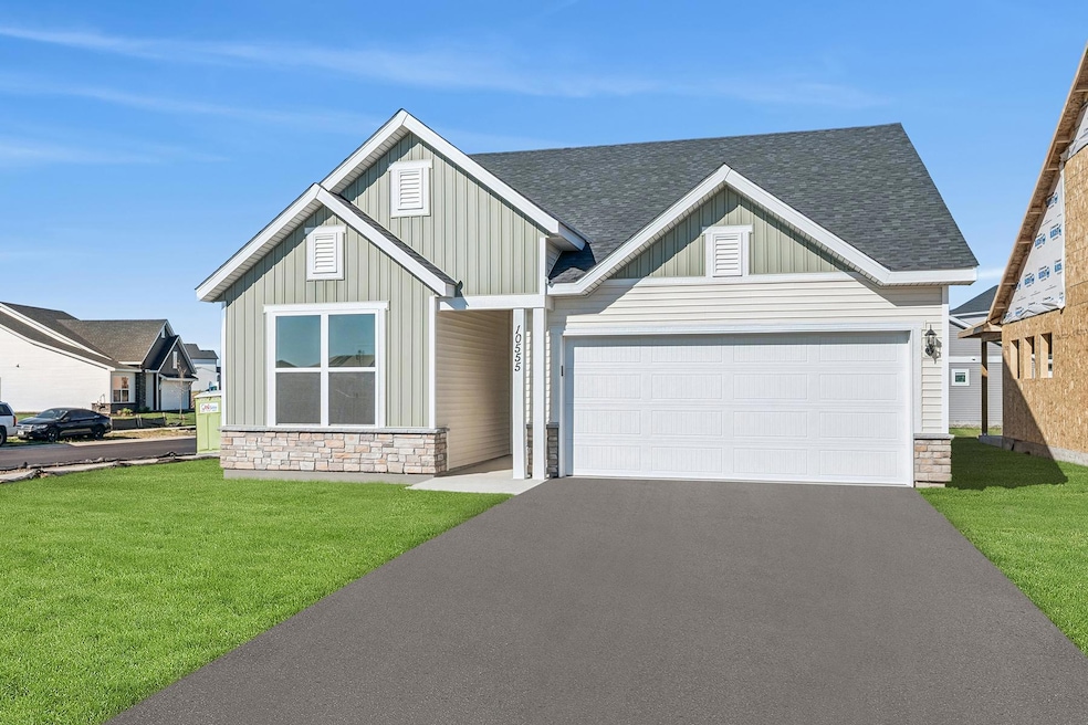 Welcome to the Carmine.  Exterior photo of the actual home.  Landscaping, mulch, irrigation and sod included.  Sod is virtually staged in this photo.