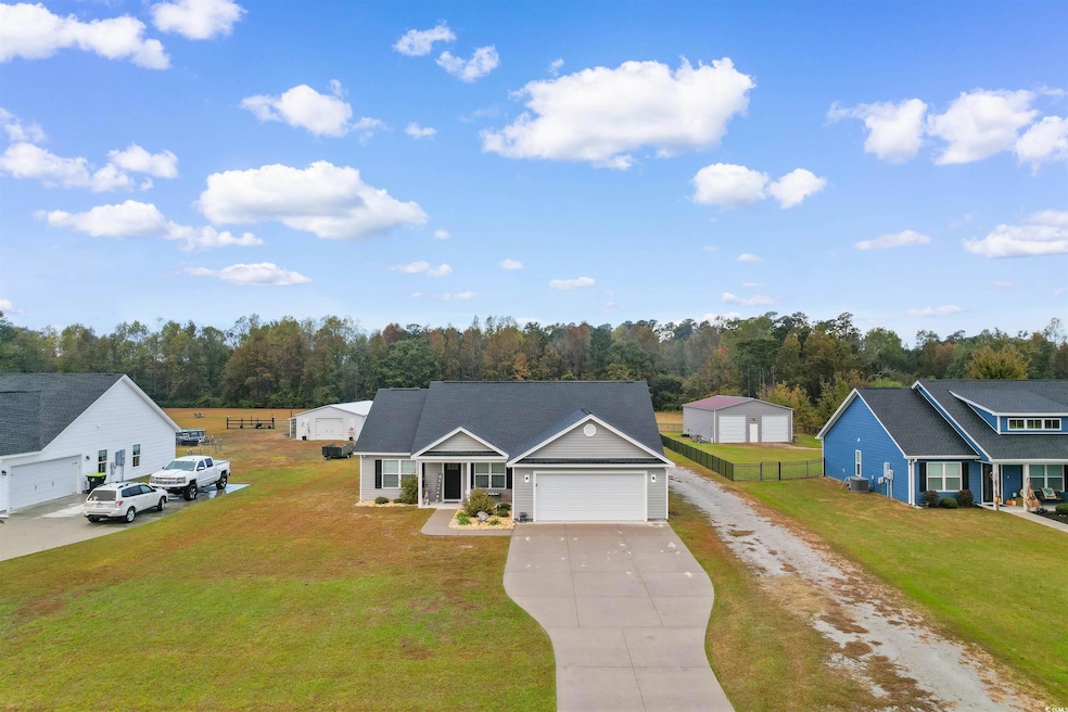 View of front of house featuring driveway and an attached garage
