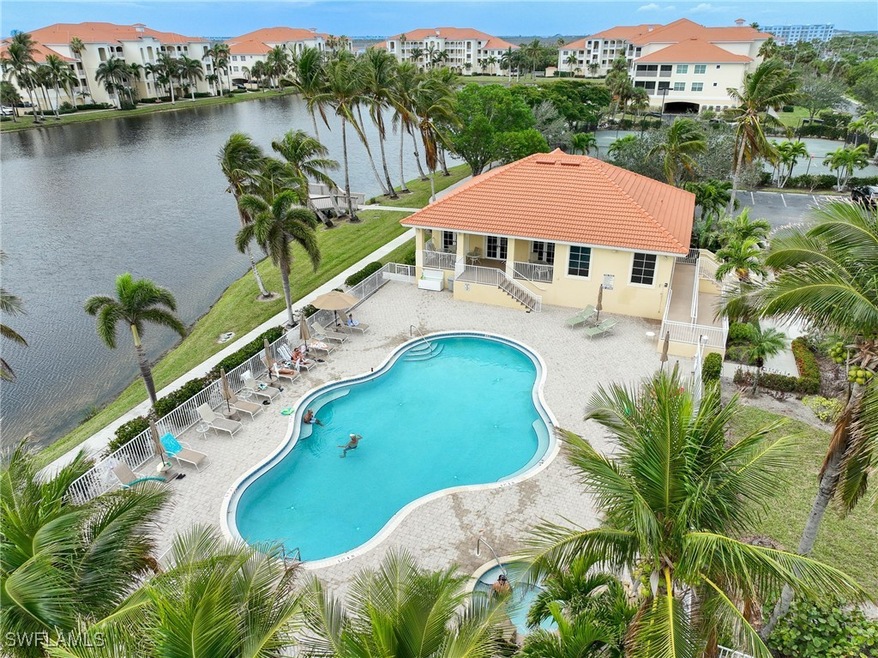 View of swimming pool featuring a patio and a wate