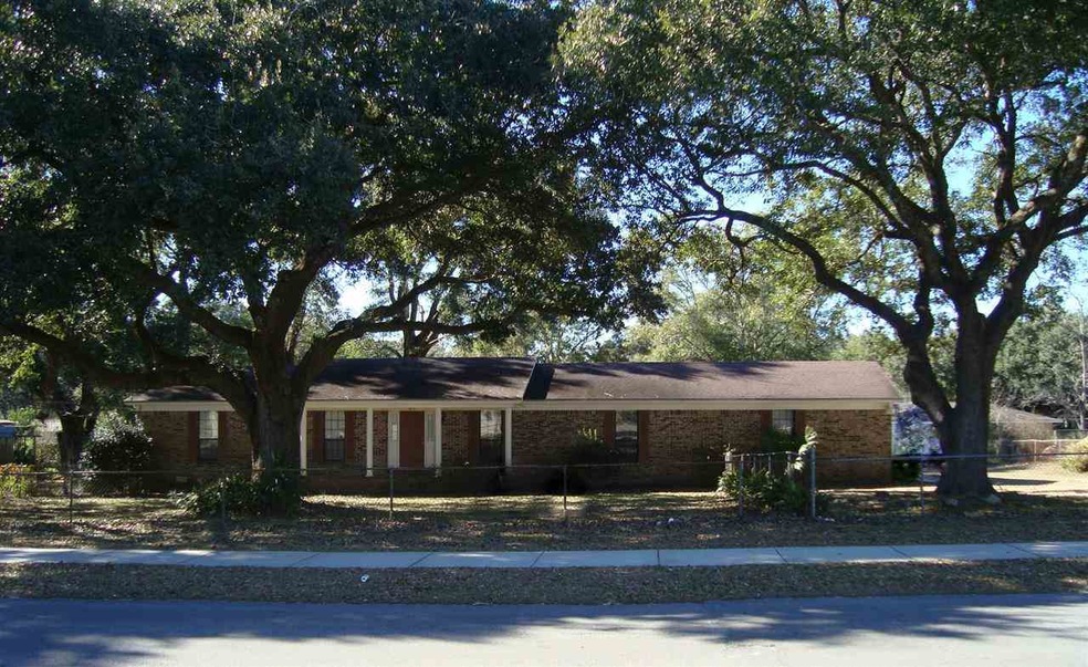 Brick home on large lot with mature trees