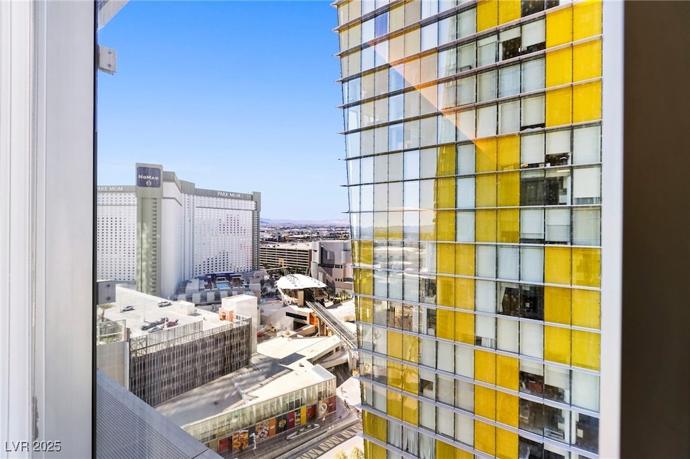 Balcony featuring a view of city