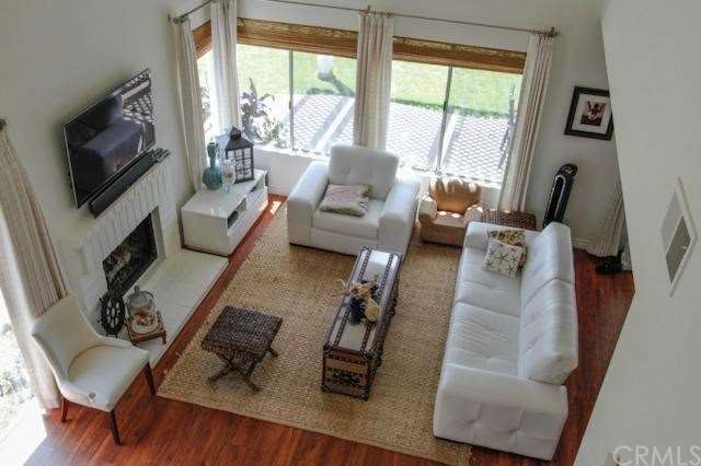 Open plan living room with soaring ceilings 