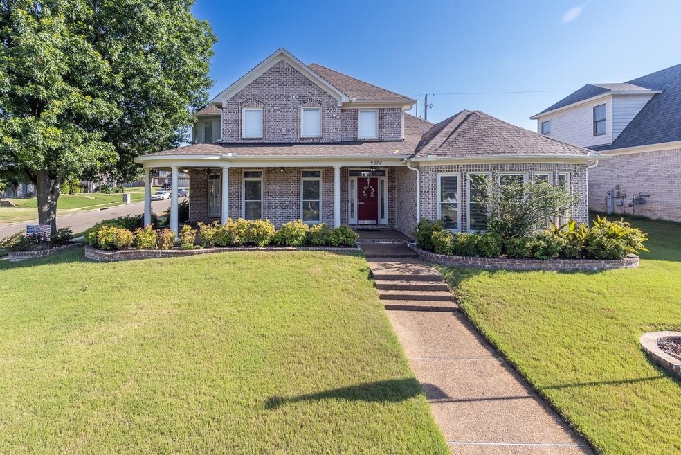 What an inviting wrap-around front porch!