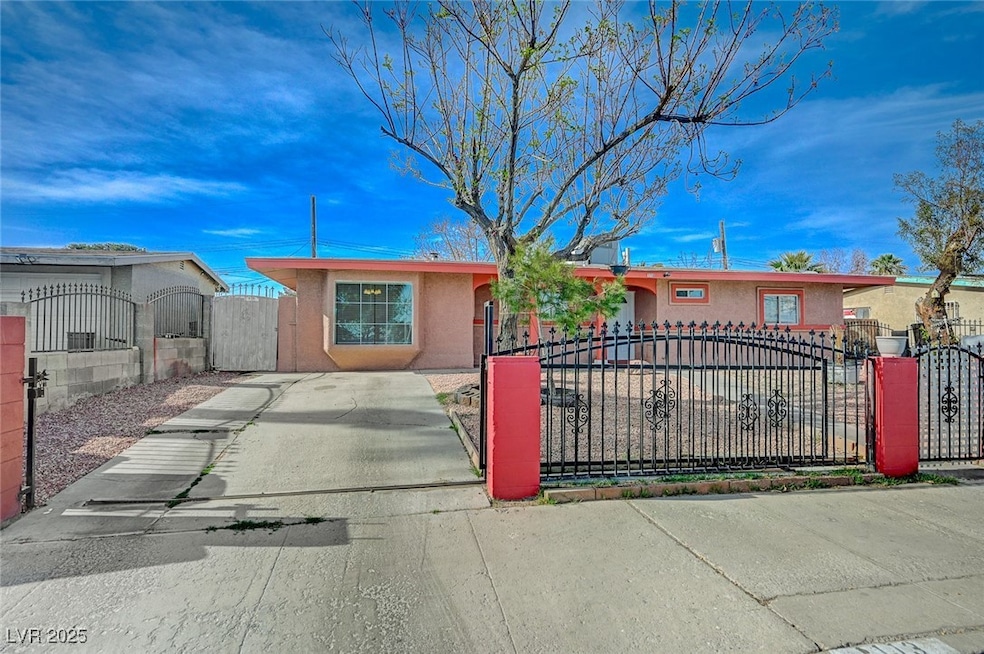 Single story home featuring driveway, stucco sidin