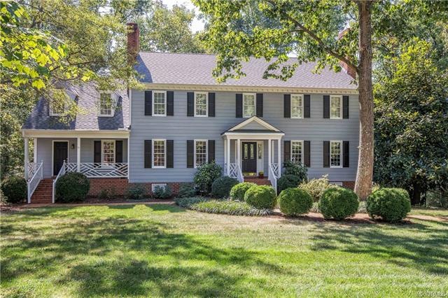 Lovely Traditional home on private wooded lot.