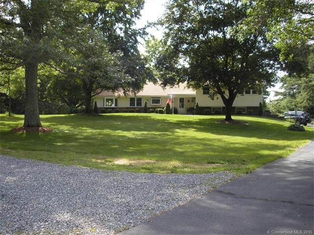 Front Exterior set far back from the road with lon