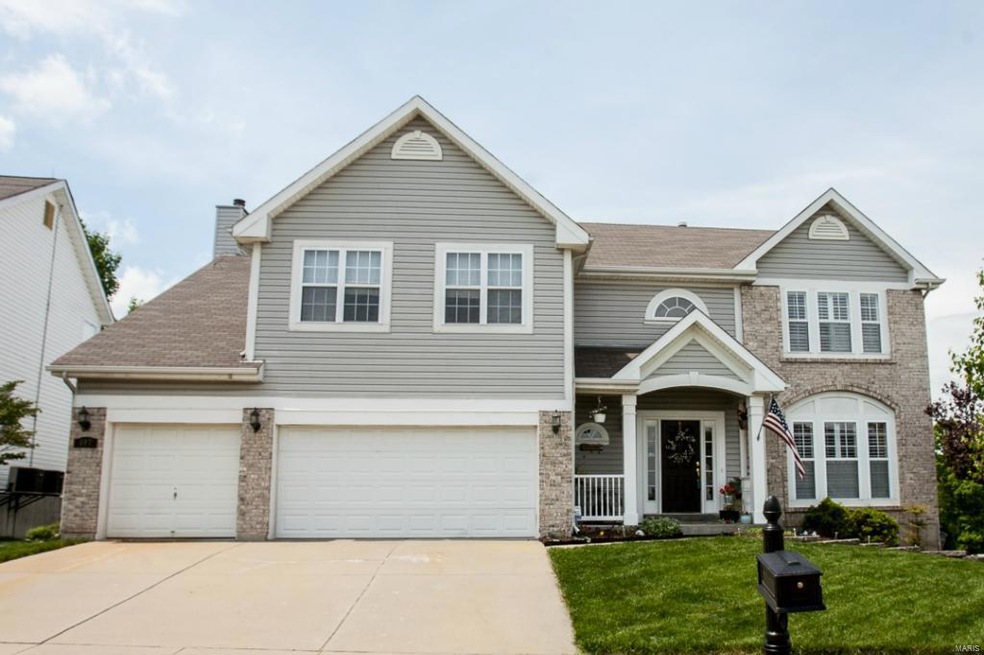 Front view of this beautiful 2 story with 3 car ga