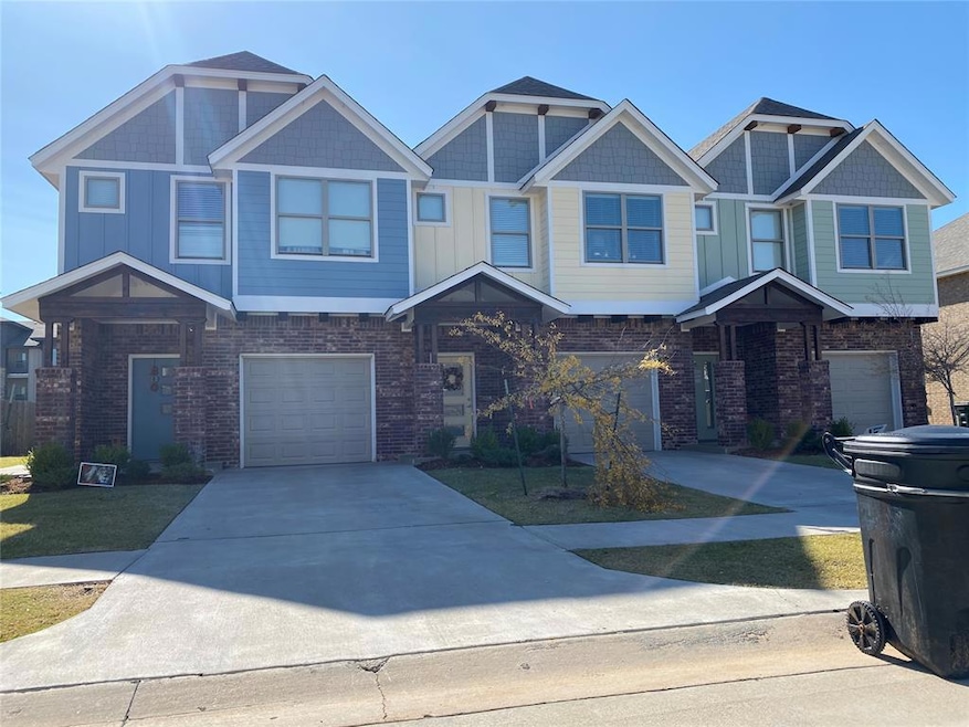 Townhome / multi-family property with brick siding