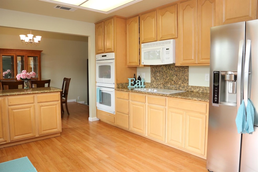 Kitchen Features Stylish Cabinetry with Glass Door