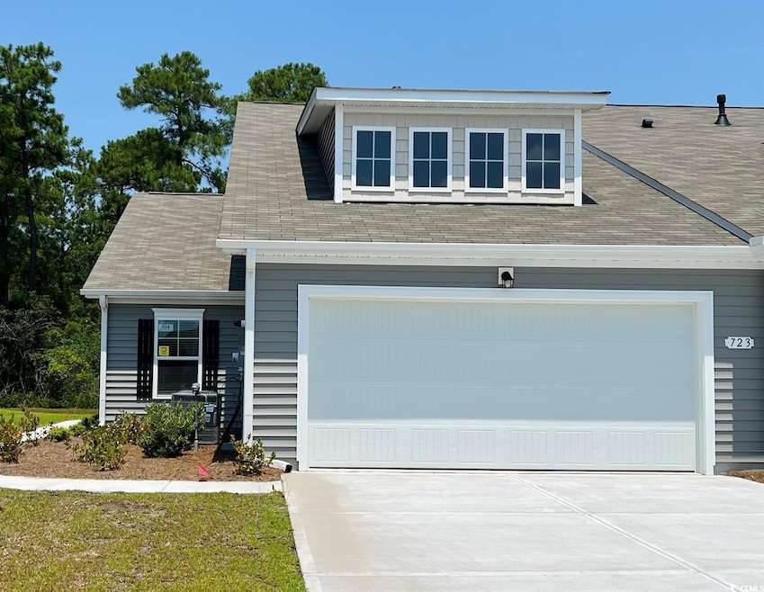 View of front of home featuring a garage
