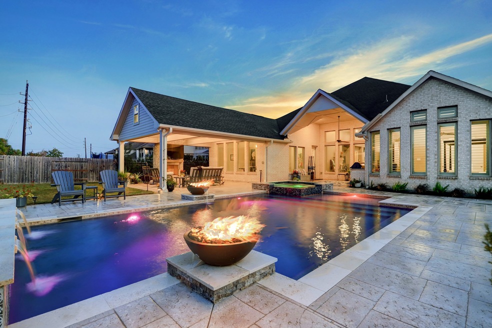 This the home you've always dreamed about! Beautifully maintained, inside and out, this single family, brick,wood and stone beauty is nestled in a cul-de-sac at 27118 Norfolk Brook Court, Katy, TX, in the Avalon at Spring Green community.