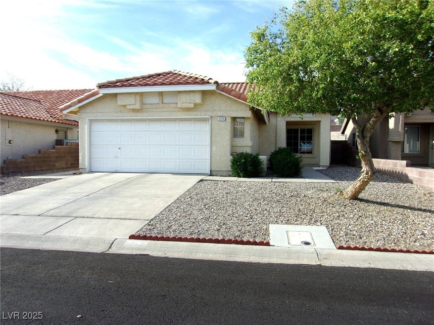 Mediterranean / spanish house featuring a tile roo