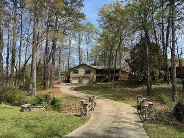 View of home's community with driveway, an attache