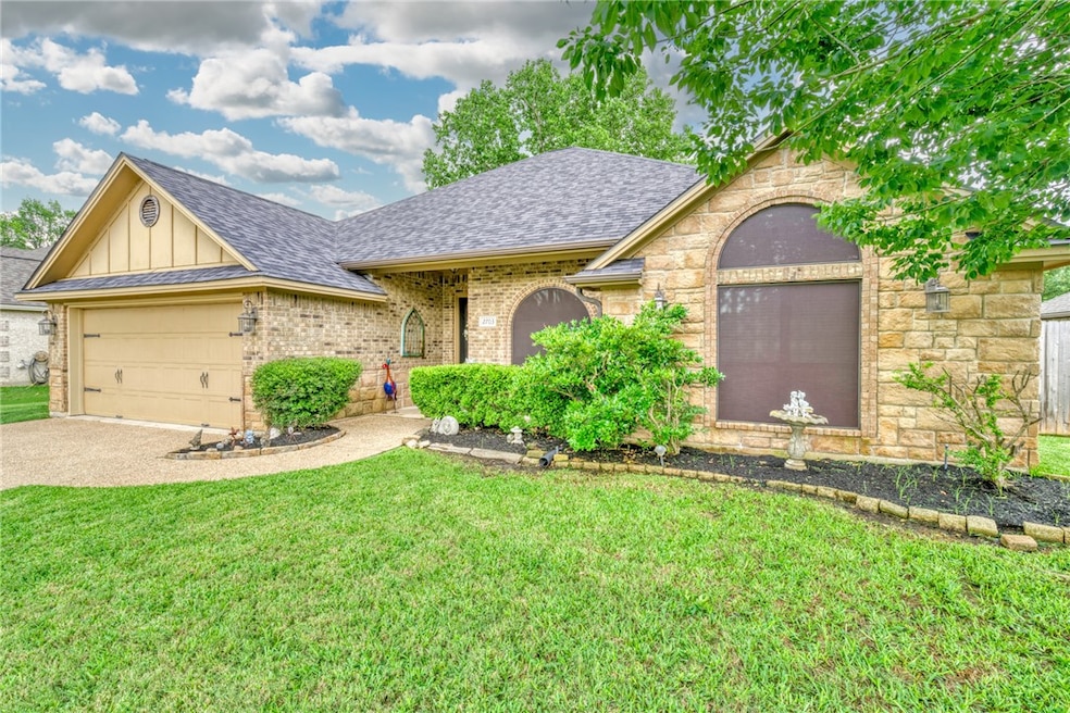 Single story home featuring roof with shingles, an