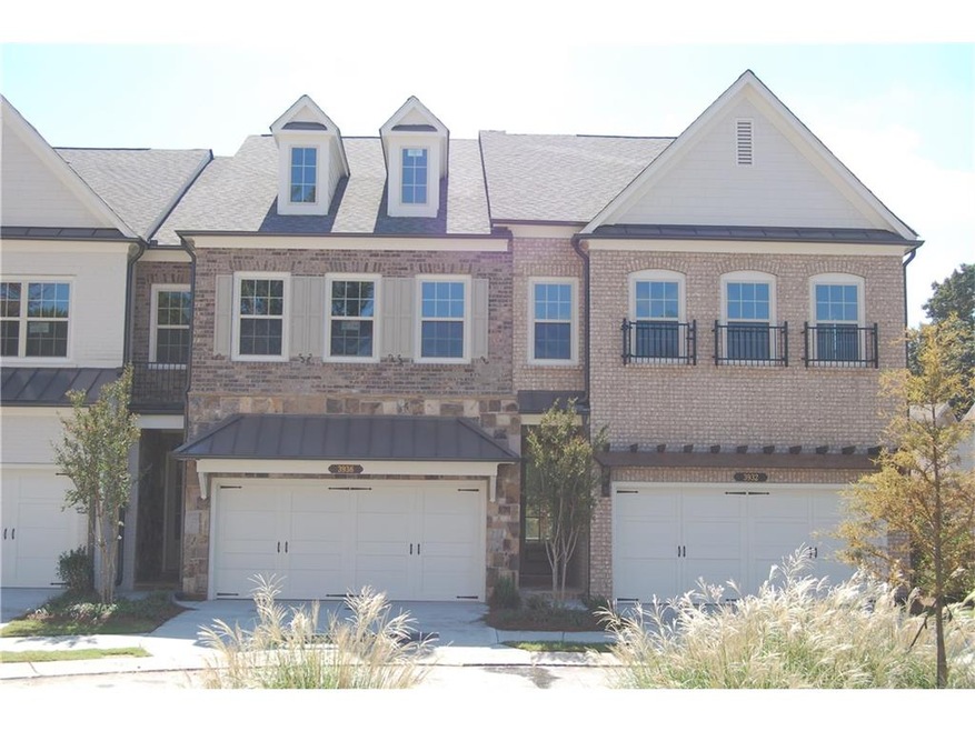 Homesite 7 has a mixed brick and stone exterior wi
