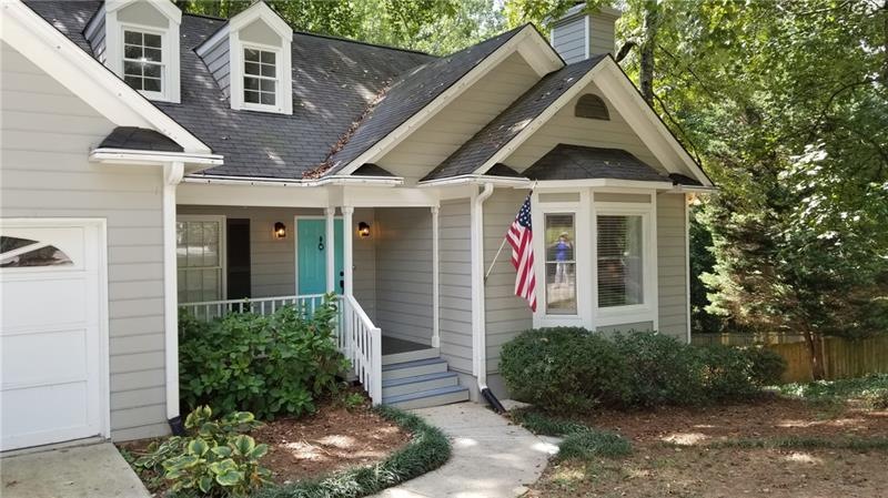 This charming home welcomes you to come and sit on