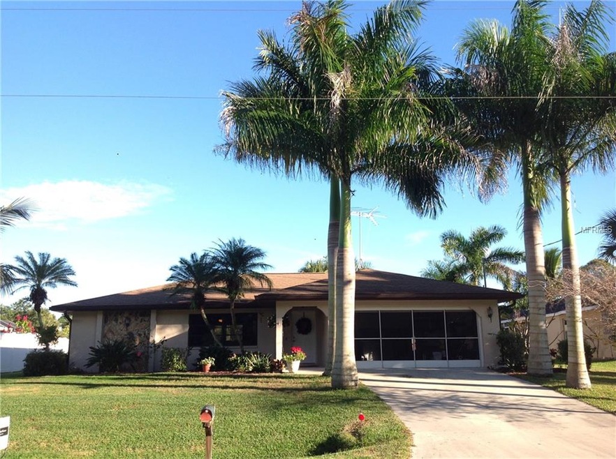 Gorgeous Royal Palm trees line the driveway.  Land
