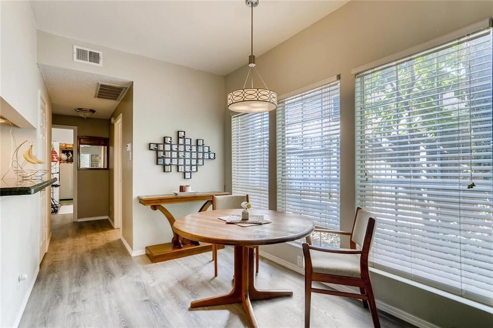 Dining area with plenty of natural light, light w