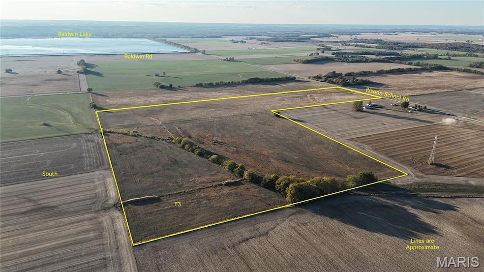 View of rural area with property parcel outlined and farmland