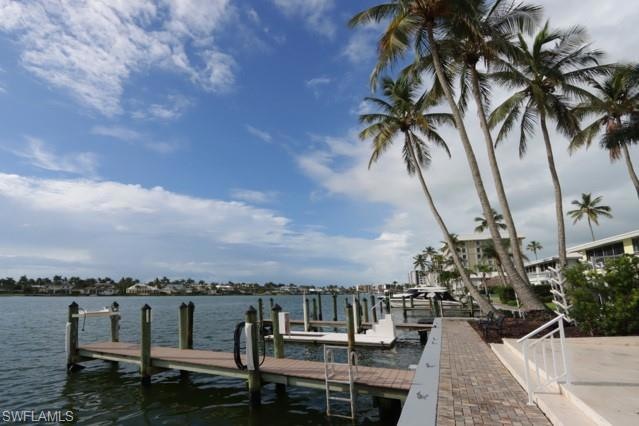 Dock area featuring a water view