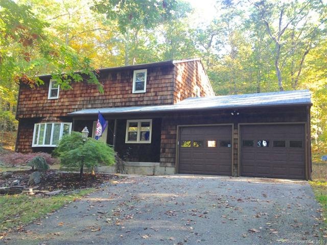 Paved driveway, neighborhood setting.