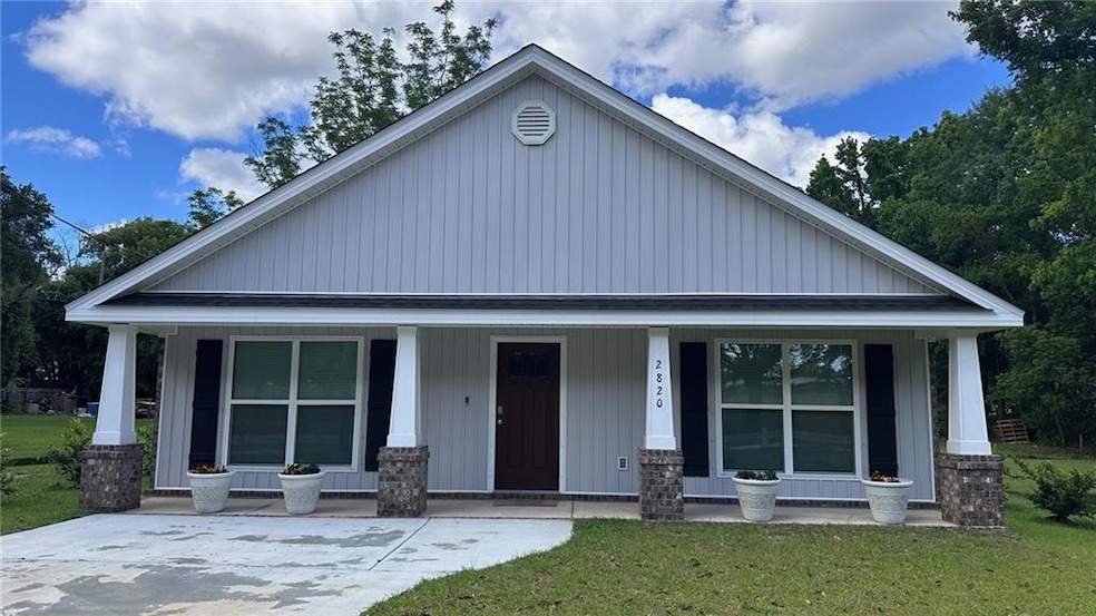 View of front of home featuring covered porch and 
