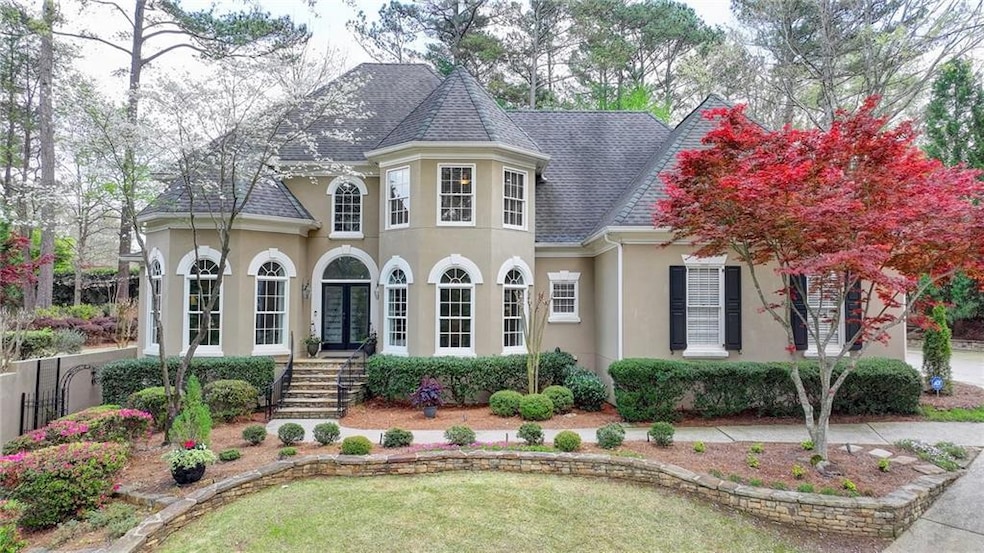 View of front of magnificently landscaped property