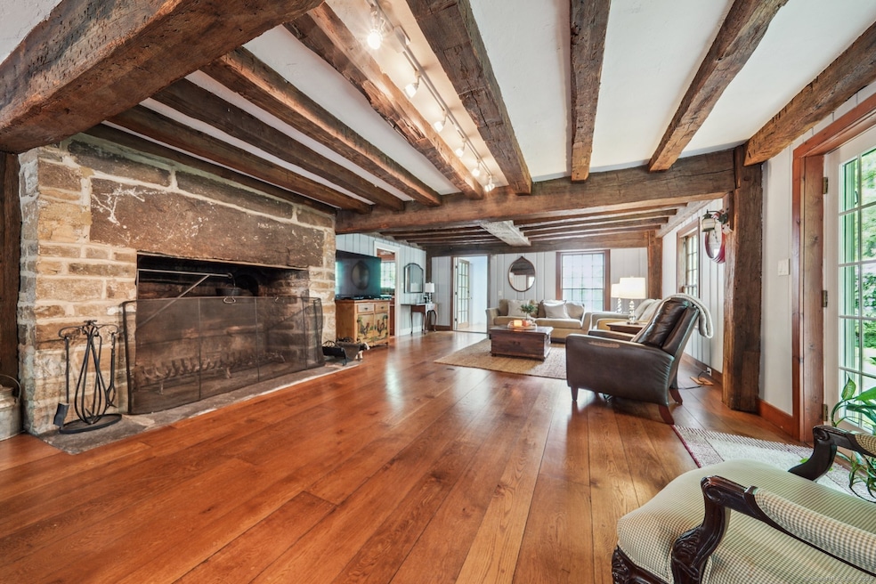 Massive fireplace takes centerstage in the Living/Dining Room combination