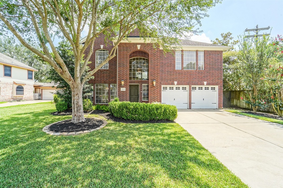 Welcome to 3815 Sunset Meadows Drive! This traditional red brick two-story home in the Sunset Lakes community in Pearland ISD boasts keystone accents, a double-wide driveway with faux carriage style garage doors, and well-manicured mature landscaping.