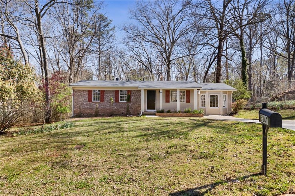 Ranch-style home with a front yard