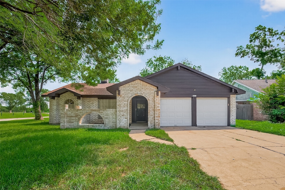 Set in the prestigious Briargate Subdivision, 15403 Blueridge Road features a charming brick-and-wood siding exterior newly painted and a spacious 2-car attached garage, framed by mature trees and vibrant green lawn that enhances the home’s inviting curb appeal.