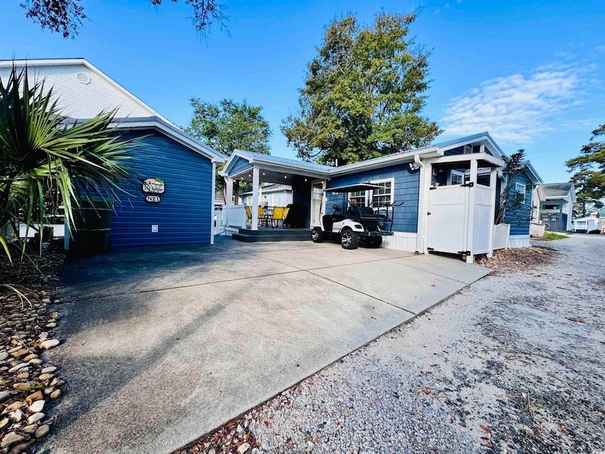 View of side of property featuring a carport
