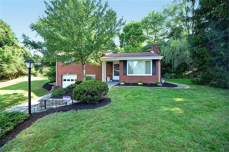 Adorable brick multi level with covered front porc
