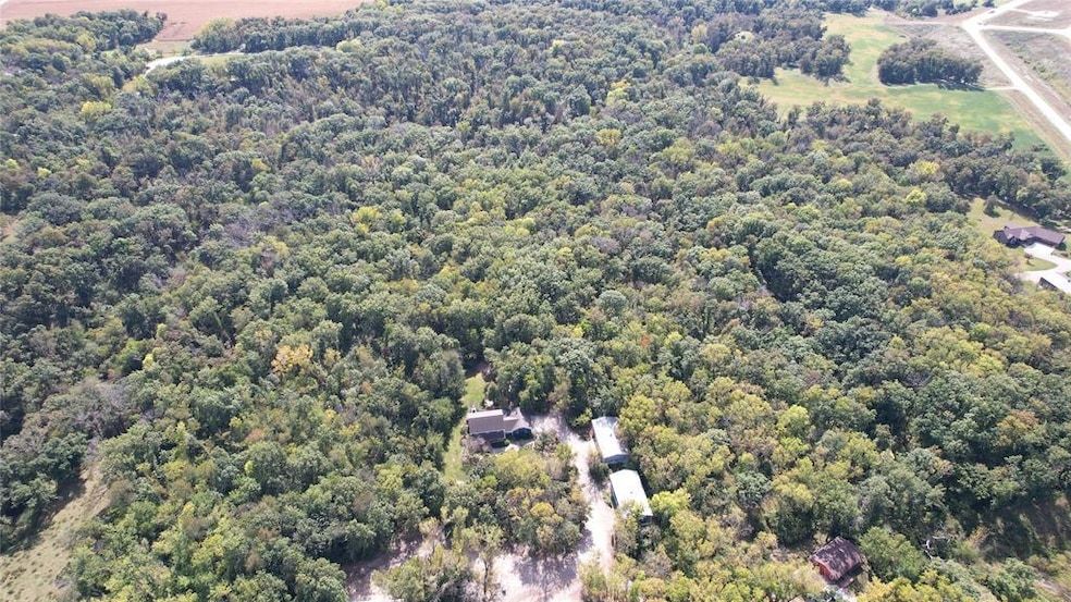 Huge wooded Acreage w Home and Bldgs