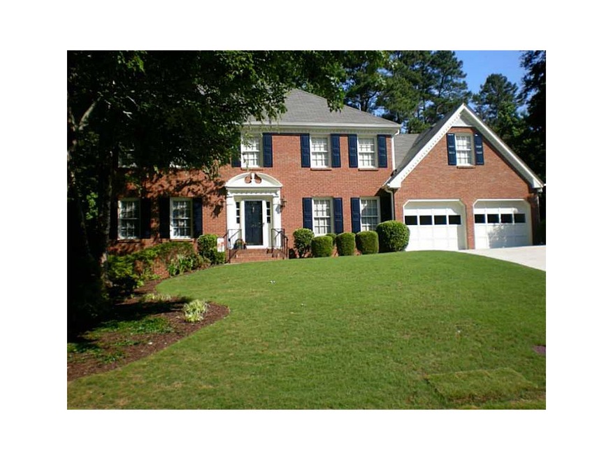 Exterior Front. 2 Story, 3 sides brick, beautifull