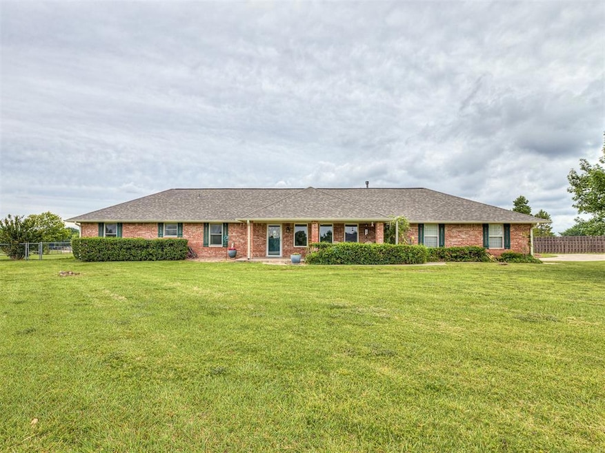 Ranch-style house featuring brick siding and roof with shingles