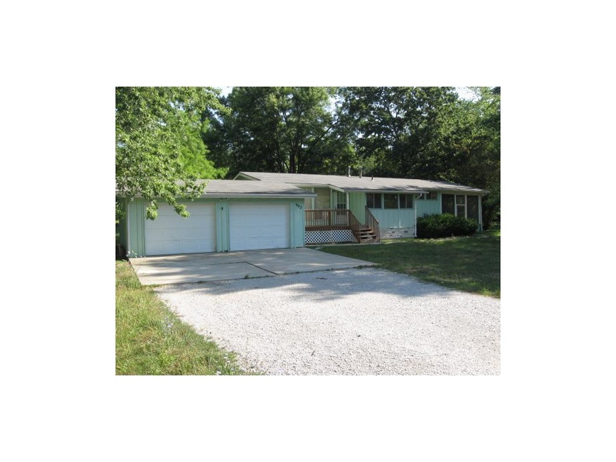Three bedroom ranch with 2 car garage on acre tree