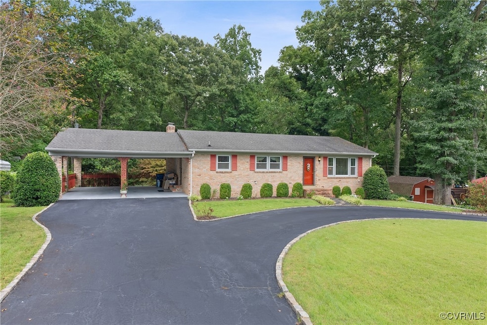 Front of home featuring the carport and front yard