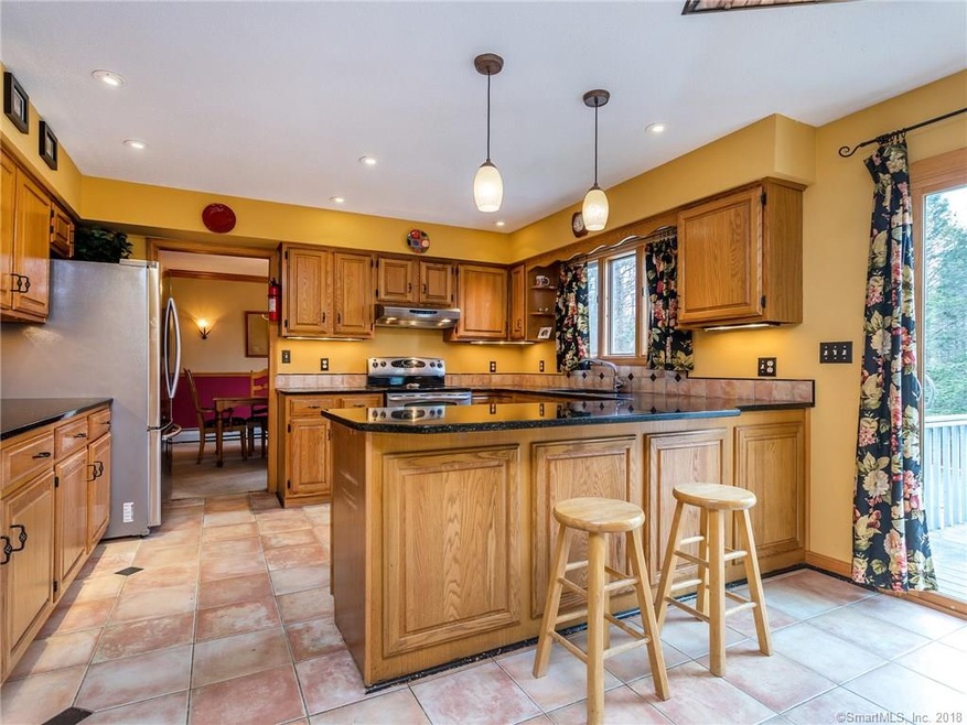 A beautiful kitchen with granite counters welcomes