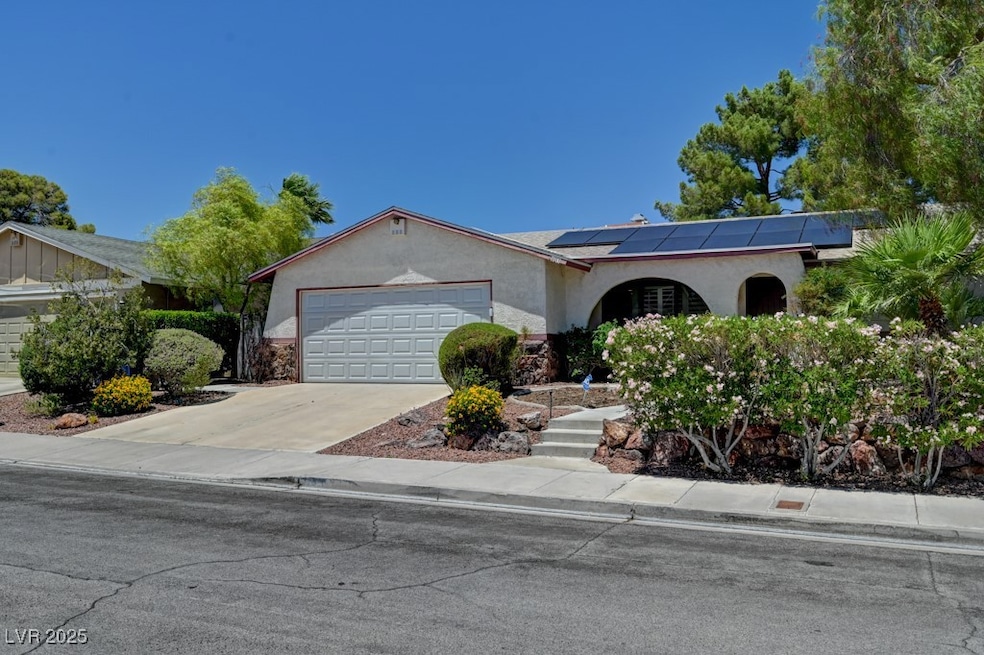 Ranch-style house with a garage, roof mounted sola