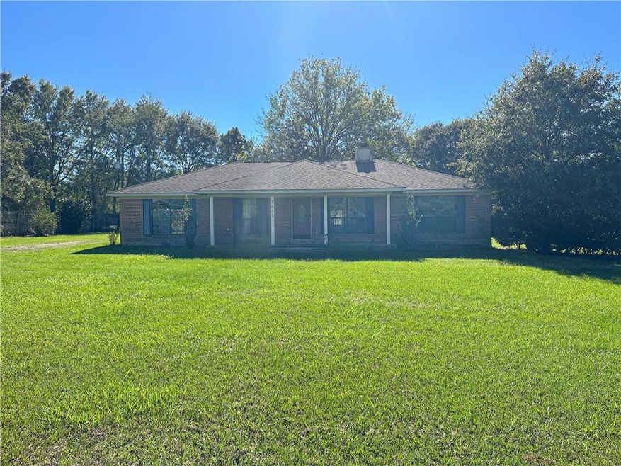 view of property featuring a yard