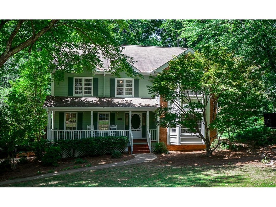 What a charming home with a wonderful front porch!
