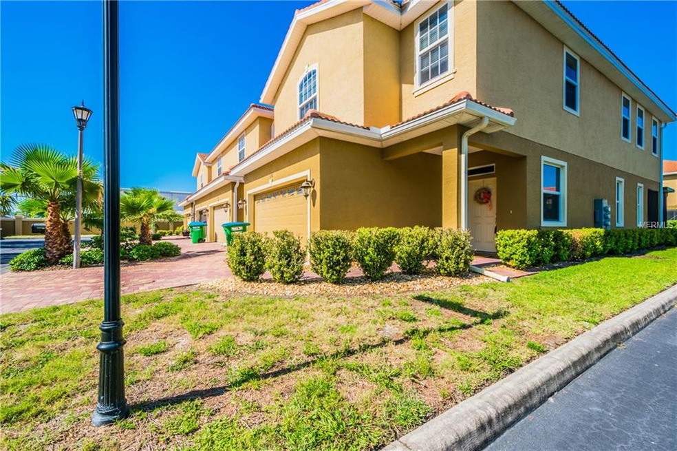 Corner unit with paved driveway and two car garage