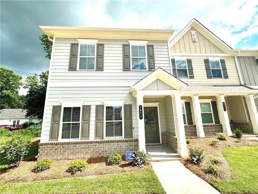 View of front of property featuring covered porch,