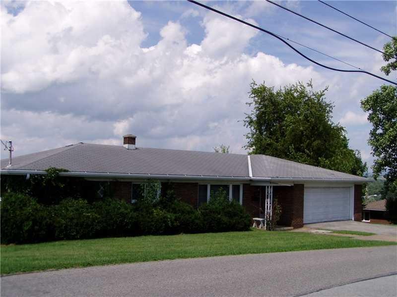 Exterior Front. Spaciou 4 bedroom brick ranch sunr