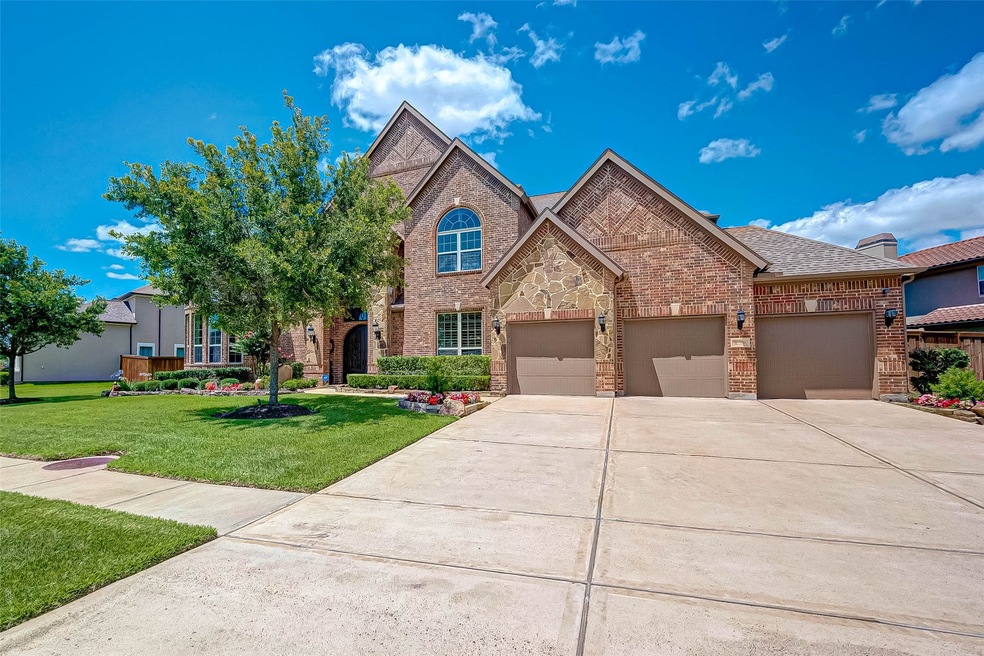 Welcome home to 2203 Granite Brook Lane where you will enjoy three separate garage bays as well as a tandem garage.  This home is fully bricked with stone accents.